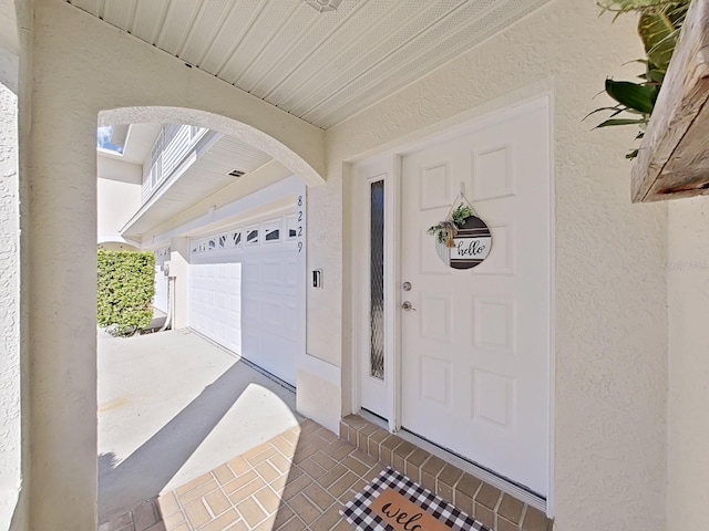 property entrance featuring a garage