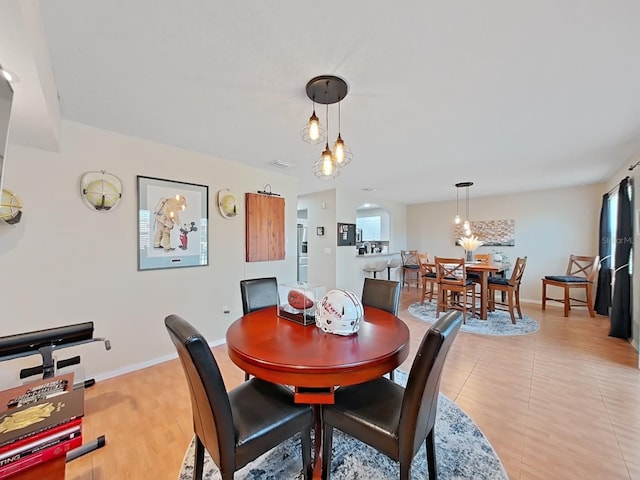 dining area featuring light wood-type flooring