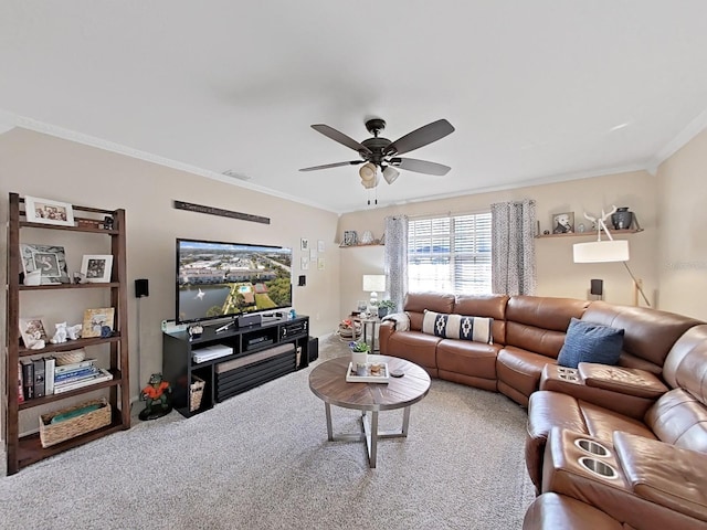 living room featuring ornamental molding, carpet, and ceiling fan