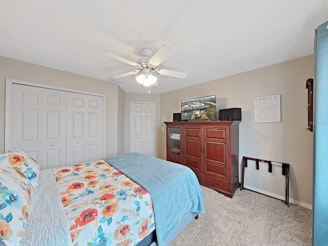 carpeted bedroom with a closet and ceiling fan