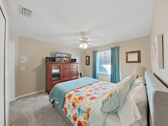 bedroom with ceiling fan and carpet flooring