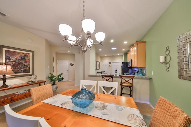 dining area featuring a chandelier