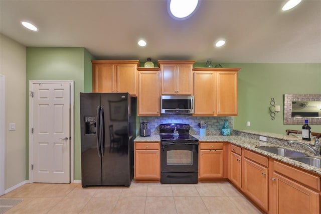 kitchen with sink, light tile patterned floors, black appliances, decorative backsplash, and kitchen peninsula