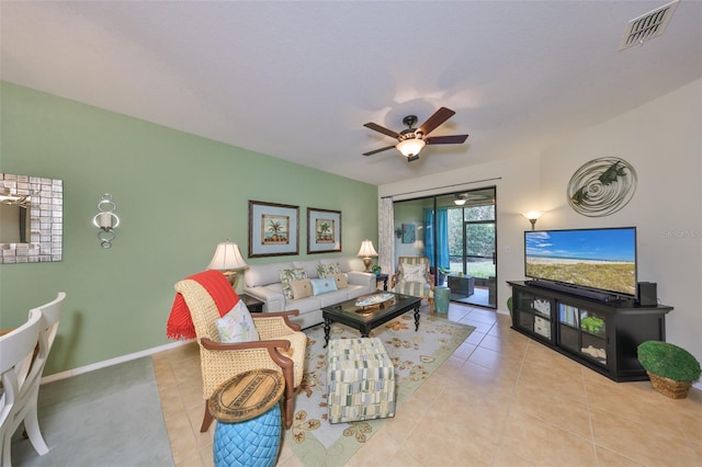 living room featuring light tile patterned floors and ceiling fan