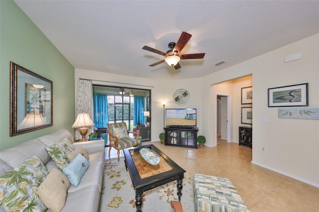 living room featuring light tile patterned flooring and ceiling fan