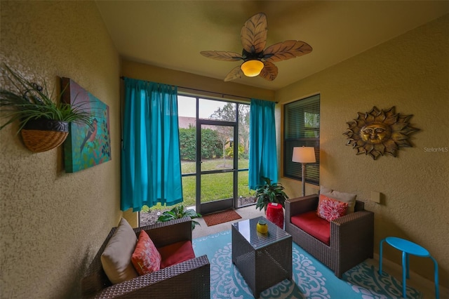 sunroom with ceiling fan