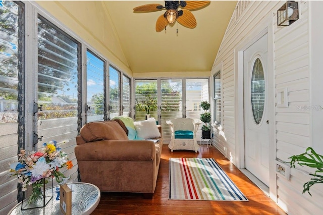 sunroom / solarium featuring lofted ceiling and ceiling fan