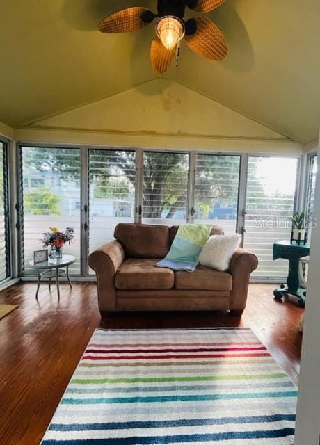 sunroom / solarium featuring ceiling fan and vaulted ceiling