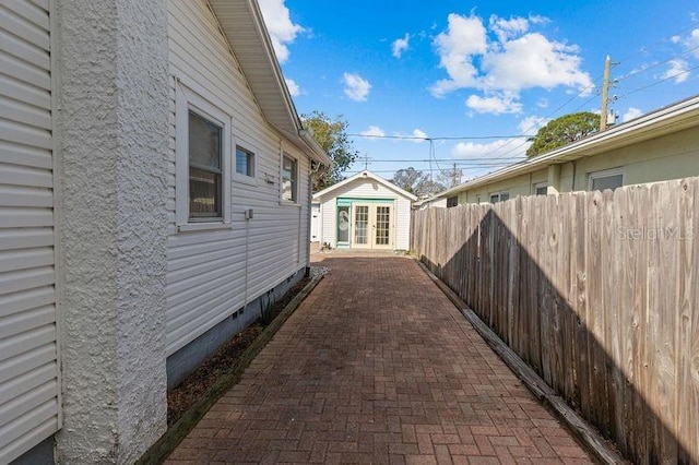 view of side of home with an outbuilding