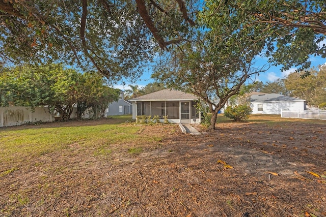 view of yard with a sunroom