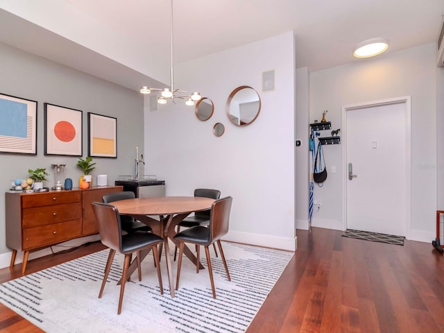 dining room with hardwood / wood-style flooring and ceiling fan