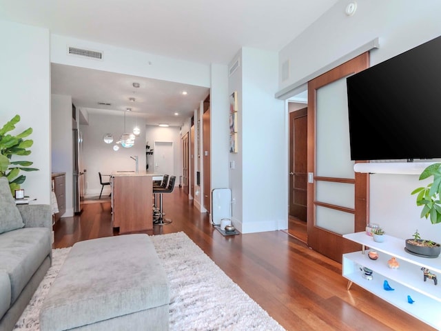 living room with dark hardwood / wood-style floors