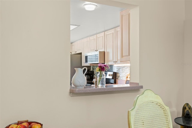 kitchen featuring decorative backsplash and appliances with stainless steel finishes