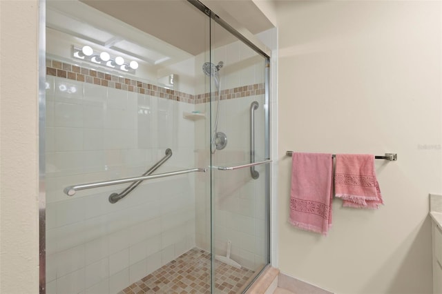 bathroom featuring a shower with door