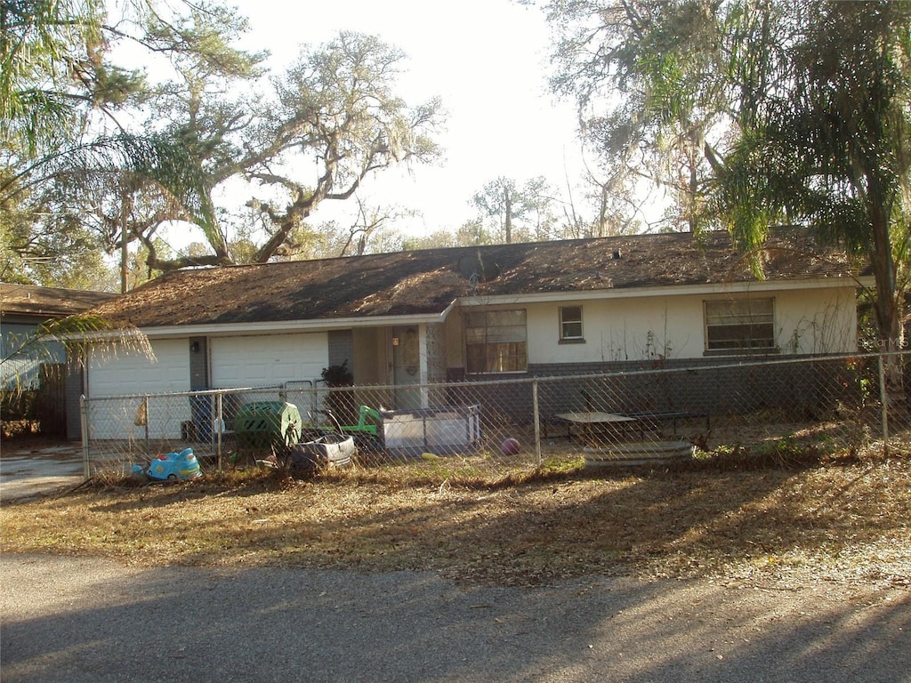 single story home with a garage