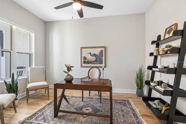 office featuring ceiling fan and light hardwood / wood-style flooring