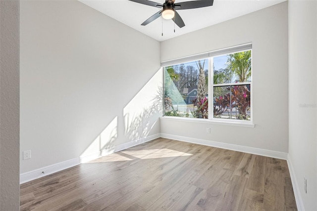 empty room with ceiling fan and light wood-type flooring