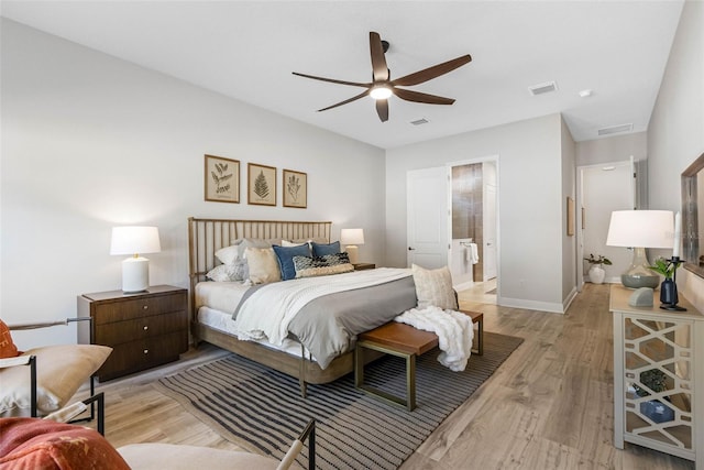 bedroom with ensuite bathroom, ceiling fan, and light wood-type flooring