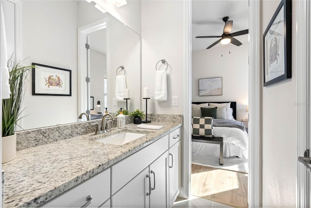 bathroom with vanity, wood-type flooring, and ceiling fan