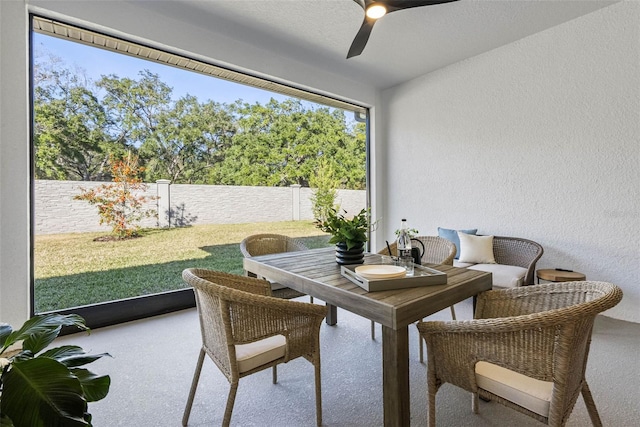 sunroom featuring ceiling fan