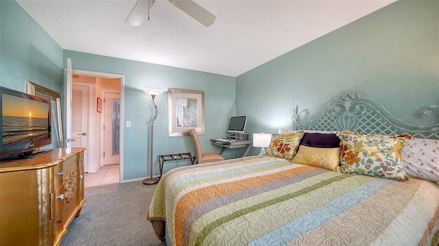 bedroom featuring light carpet and ceiling fan