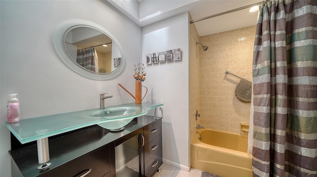 bathroom featuring tile patterned floors, vanity, and shower / bathtub combination with curtain