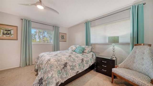 bedroom with light carpet and ceiling fan