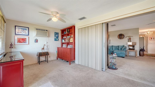 misc room featuring light carpet, ceiling fan with notable chandelier, and a wall unit AC