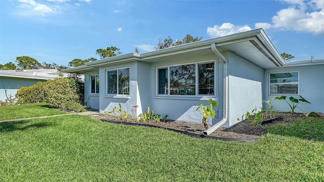 view of property exterior featuring a yard