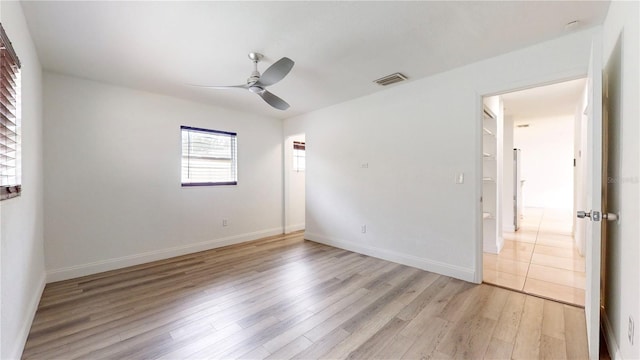 unfurnished room featuring ceiling fan and light wood-type flooring