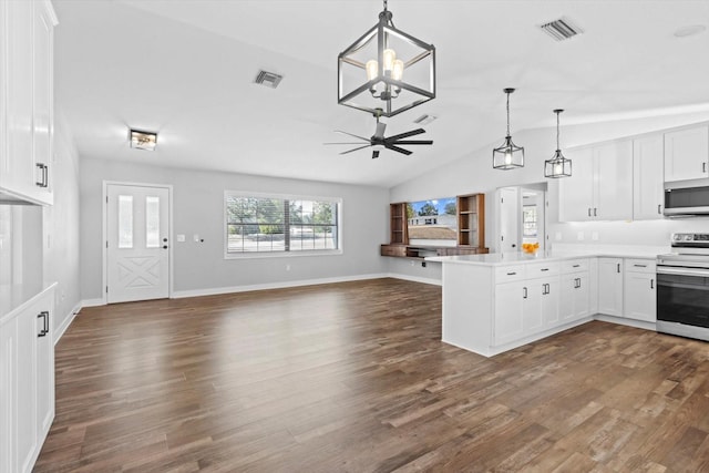 kitchen with appliances with stainless steel finishes, pendant lighting, white cabinets, dark hardwood / wood-style flooring, and kitchen peninsula