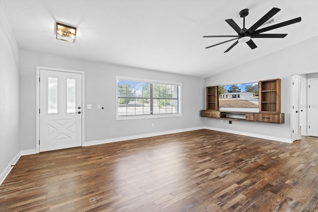 unfurnished living room featuring dark hardwood / wood-style flooring, lofted ceiling, and ceiling fan