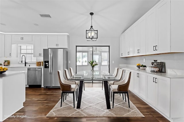 kitchen with white cabinetry and stainless steel appliances