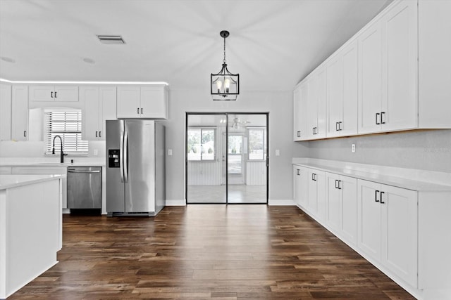 kitchen with white cabinetry, sink, dark hardwood / wood-style flooring, and appliances with stainless steel finishes