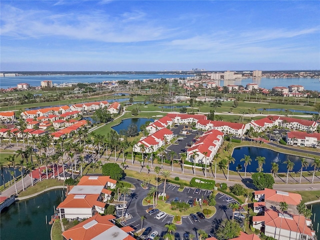 birds eye view of property with a water view