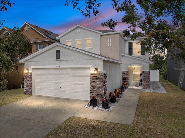 view of front facade featuring a yard and a garage