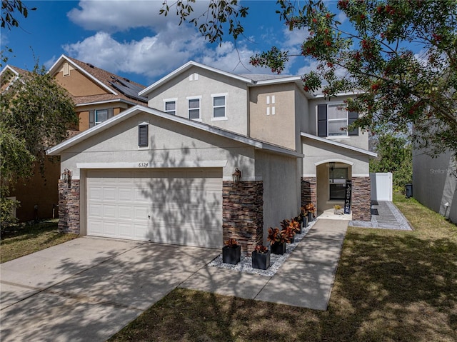 view of front facade with a garage and a front yard