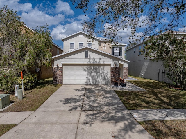 view of front property with a garage and a front yard