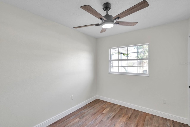 unfurnished room featuring hardwood / wood-style flooring, ceiling fan, and a textured ceiling