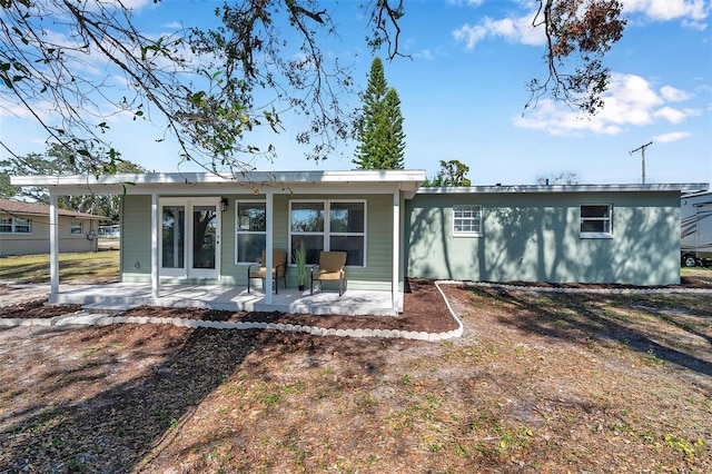 rear view of house featuring a patio area