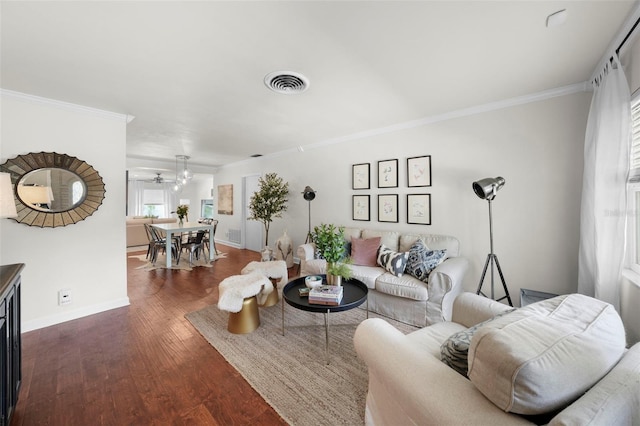 living room featuring ornamental molding and dark hardwood / wood-style flooring