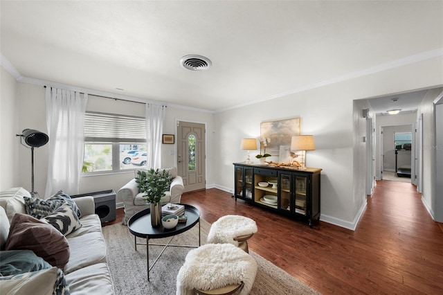 living room featuring ornamental molding and dark hardwood / wood-style flooring