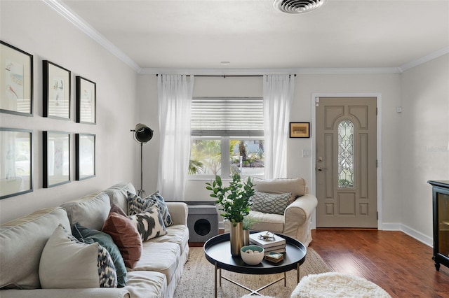 living room featuring crown molding and dark hardwood / wood-style flooring