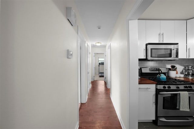 hallway featuring dark hardwood / wood-style floors