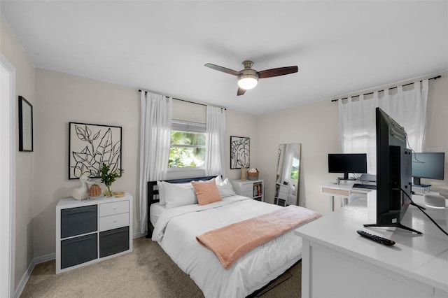 bedroom featuring ceiling fan and light colored carpet