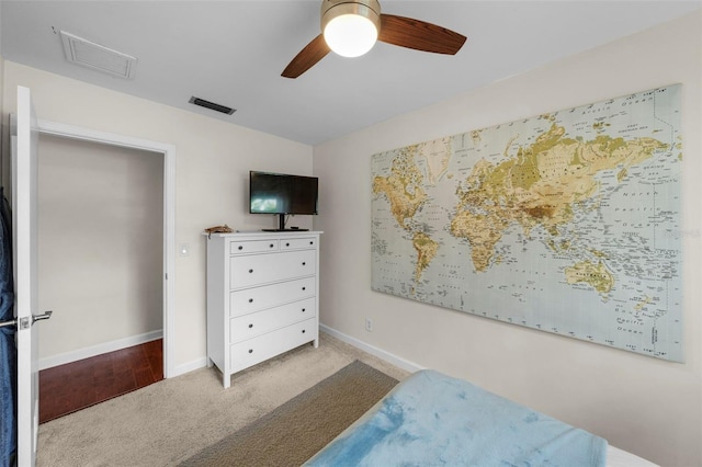 bedroom with ceiling fan and light carpet