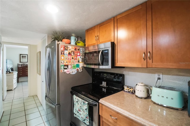 kitchen with range with electric cooktop and light tile patterned floors