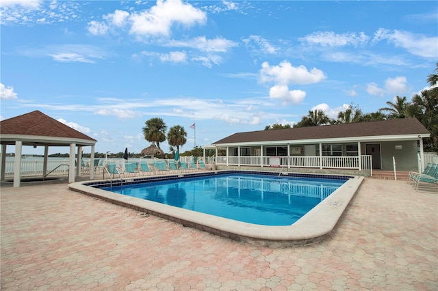 view of swimming pool with a gazebo and a patio