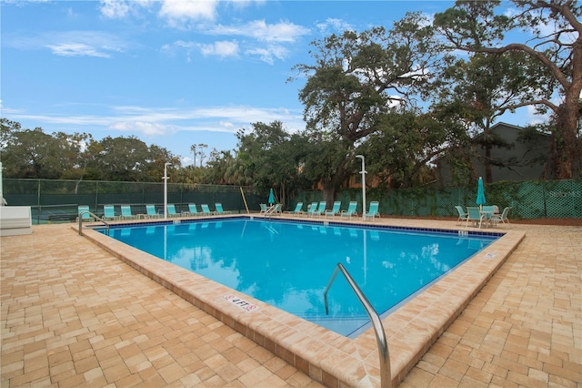 view of swimming pool with a patio area