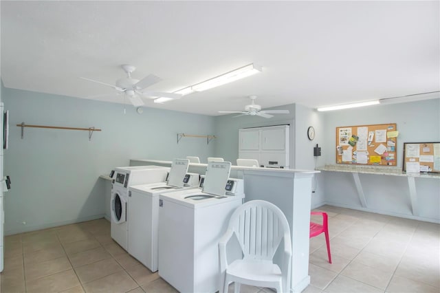 washroom with light tile patterned flooring, washing machine and clothes dryer, stacked washer and clothes dryer, and ceiling fan